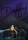 th_28203_celeb-city.org-The_Elder-Duffy_2009-03-31_-_performs_on_stage_at_Vector_Arena_in_Auckland_627_122_152lo.jpg