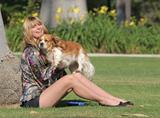 Mischa Barton walking and playing with her dog in a park in Los Angeles