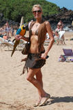 Paris Hilton posing in bikini with parrot at the beach in Hawaii - Hot Celebs Home